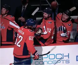  ?? GEOFF BURKE/USA TODAY SPORTS ?? Capitals left wing Carl Hagelin (62) celebrates with teammates after scoring a goal against the Flyers on Tuesday.