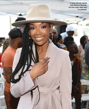  ?? ?? In June, Brandy signed
with Motown Records, her first major-label deal
in a decade.