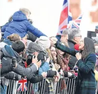  ?? Pictures: PA. ?? Clockwise from above: Meghan and Harry greet the Edinburgh crowds; Prince Harry and his fianceé during their Edinburgh walkabout; the couple during their visit to Social Bite; Pony Major Mark Wilkinson introduces the couple to Royal Regiment of...