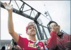  ?? Picture: AFP PHOTO ?? Ferrari's Sebastian Vettel waves to the fans before the start of practice sessions yesterday