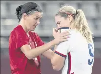  ?? FRANK GUNN — THE CANADIAN PRESS VIA AP ?? Canada’s Christine Sinclair, left, consoles the United States’ Lindsey Horan after Canada won Monday’s Olympic semifinal match