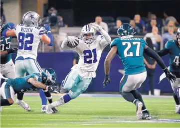  ?? RON JENKINS/ASSOCIATED PRESS ?? Dallas running back Ezekiel Elliott (21) looks for room to run during the Cowboys’ win over the Eagles Sunday.