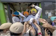  ?? AP PHOTO ?? MAD AT MODI
Members and supporters of India’s opposition Aam Aadmi Party shout slogans as they are detained by police during a protest against the arrest of their party leader Arvind Kejriwal in the capital New Delhi on Saturday, March 23, 2024.
