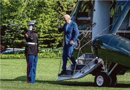  ?? Jim Watson/AFP/TNS ?? President Joe Biden boards Marine One in May 2022 on the South Lawn of the White House.