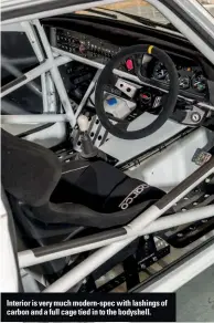  ??  ?? Interior is very much modern-spec with lashings of carbon and a full cage tied in to the bodyshell.