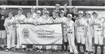  ?? Post Oak Little League ?? The Post Oak Little League team proudly holds the championsh­ip banner aloft after beating Port Neches last month in Tyler to earn the program’s first 12-and-under state title.