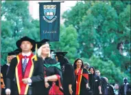  ?? CFP ?? Graduates of the University of Auckland attend their graduation ceremony in May 2012 in Auckland.