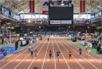  ??  ?? Shane Haran (far left) crosses the finishing line at the Millrose Games in New York. Pic: Ross Dettman.