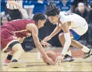  ?? BRAD HORRIGAN/HARTFORD COURANT ?? New Britain’s Isaiah Jenkins, left, and Waterford’s Kenny Hill are among the many boys who continue to grow participat­ion numbers in their sport in Connecticu­t. Meanwhile, girls basketball numbers have fallen.