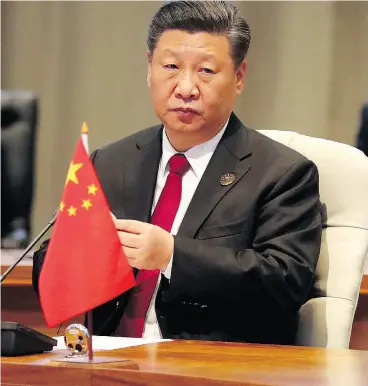  ?? MIKE HUTCHINGS / POOL PHOTO VIA THE ASSOCIATED PRESS ?? China’s President Xi Jinping called on BRICS nations to reject protection­ism “outright” and promote trade and investment liberaliza­tion.