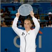  ?? AP ?? Svetlana Kuznetsova holds aloft her trophy. —