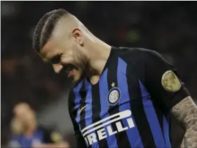  ??  ?? Inter Milan’s Mauro Icardi grimaces during a Serie A soccer match between Inter Milan and Chievo, at the San Siro stadium in Milan, Italy, on Monday. AP PHOTO/LUCA BRUNO