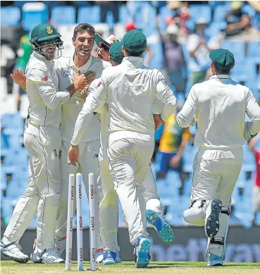  ?? Picture: AFP ?? Duanne Olivier celebrates after getting the wicket of Sarfraz Ahmed on day one of the first Test against Pakistan at SuperSport Park in Centurion. It was the fast bowler’s internatio­nal debut.