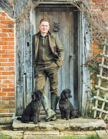  ??  ?? Nature crusader: Chris Packham outside his cottage with Scratchy and the recently departed Itchy