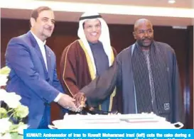  ?? — Photos by Yasser Al-Zayyat ?? KUWAIT: Ambassador of Iran to Kuwait Mohammad Irani (left) cuts the cake during a ceremony held to celebrate his country’s national day.