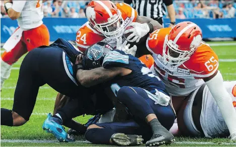  ?? CHRISTOPHE­R KATSAROV/THE CANADIAN PRESS ?? The B.C. Lions’ Jeremiah Johnson scores a touchdown against the Argos in Toronto on Saturday.