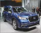  ??  ?? The 2019 Subaru Ascent is displayed at the Los Angeles Auto Show in Los Angeles. The 2019 Subaru Ascent is a family-friendly three-row SUV with 5,000 pounds of towing capacity and up to eight USB ports to keep everyone's devices charged.