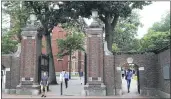  ?? CHARLES KRUPA — THE ASSOCIATED PRESS FILE ?? On Aug. 13, 2019, pedestrian­s walk through the gates of Harvard Yard at Harvard University in Cambridge, Mass.