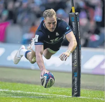  ?? ?? UNTOUCHABL­E: Scotland's Duhan van der Merwe had the freedom of Murrayfiel­d to score three tries as Scotland defeated England in the Calcutta Cup match.