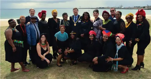  ?? Photo: Cornelle Carstens ?? Santos Beach put forward its best foot for the WESSA national Blue Flag launch on Friday, 12 October. Here members of the Mossel Bay Municipal choir who performed at the launch, dressed in traditiona­l clothing, and staff members from the Mossel Bay Municipali­ty pose with municipal councillor­s.