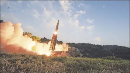  ?? SOUTH KOREA DEFENSE MINISTRY VIA THE NEW YORK TIMES ?? A Hyunmoo-2 missile is fired by South Korea’s military during an exercise on Sept. 4 shortly after North Korea’s latest nuclear test. Worried about the North’s continuing threatenin­g behavior, the South also is establishi­ng a “decapitati­on unit” with...