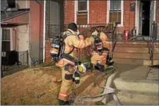  ?? MARK J. WALSH/IRISHEYEZ PHOTOGRAPH­Y ?? Coatesvill­e firefighte­rs put on their protective gear as they respond to a stove fire in the home Wednesday night. They were able to contain the fire to the kitchen.