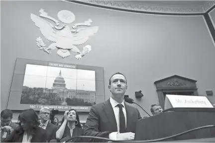  ??  ?? Facebook CEO Mark Zuckerberg testifies April 11 at a House energy and commerce committee hearing on Capitol Hill about the use of Facebook data to target American voters in the 2016 election. JACQUELYN MARTIN/AP