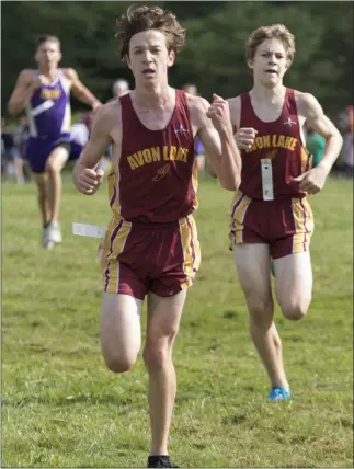  ?? JENNIFER FORBUS — FOR THE MORNING JOURNAL ?? Ryan Keller, left, and Matt Henry of Avon Lake finishing their race during a Southweste­rn Conference preview cross country meet.