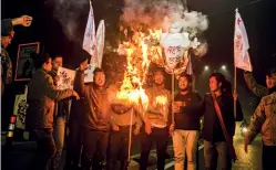  ??  ?? UP IN FLAMES Students protest against the Citizenshi­p (Amendment) Bill, 2016, in Guwahati