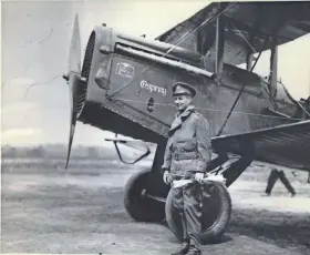  ??  ?? Gen. Billy Mitchell poses in May 1922 with his De Havilland DH-4B bomber at Milwaukee’s old Butler Airport, now the northwest end of the Currie Park golf course in Wauwatosa. Mitchell flew the bomber, nicknamed the Osprey, during the 1921 bomb tests, which included the sinking of the captured German battleship Ostfriesla­nd.