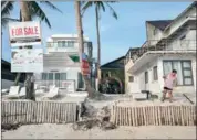  ?? AFP JES AZNAR/THE NEW YORK TIMES ?? Houses for sale at Bulabog Beach on Boracay, a Philippine island that has rapidly become a major travel destinatio­n, March 28.