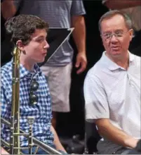  ??  ?? Bill Smith, West Chester University Class of 1983 graduate, talks with WCU junior, Michael Kaplan, during the university’s jazz ensemble alumni practice. Smith was an Air Force musician after his graduation from WCU.