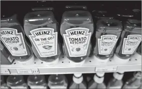  ?? DANIEL ACKER/ BLOOMBERG ?? Kraft Heinz stock plunged as much as 16 percent to $26.05 Thursday, the lowest intraday level since the company was formed in a 2015 merger orchestrat­ed by Warren Buffett and the private equity firm 3G Capital. The company has now seen about $20 billion in market value wiped out this year.