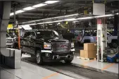  ?? RYAN GARZA/DETROIT FREE PRESS ?? A GMC Denali HD pulls out for final testing at the General Motors plant in Flint, Mich. on Feb. 5, 2019.