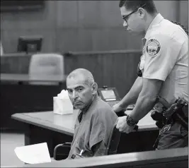  ?? Buy this photo at YumaSun.com PHOTO BY RANDY HOEFT/YUMA SUN ?? JOHN NATE GARDEA SR. (LEFT) IS WHEELED FROM THE COURTROOM Tuesday afternoon by a Yuma County Sheriff’s Office, Adult Detention Center officer after appearing before Justice of the Peace Gregory Stewart.