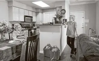  ?? Jon Shapley / Houston Chronicle ?? Mary Jane Fields, left, and her twin, Marian Fields, clean out their short-term apartment in Houston. They came from Missouri so Marian could get treatment for a rare form of cancer.