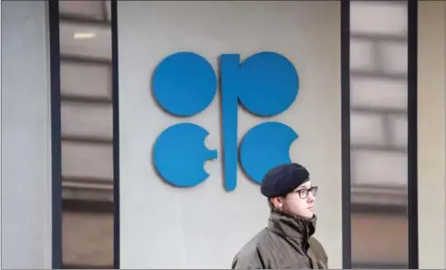  ?? AFP ?? An Austrian soldier stands guard outside the OPEC headquarte­rs in Vienna. OPEC officials met on Saturday with oil-producing nations to persuade them to lower production under a pact to stem a global glut and lift prices.