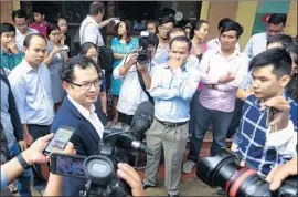  ?? Associated Press ?? KAY KIMSONG, left, editor in chief of the Phnom Penh Post, speaks out after being fired by the paper’s new owner for running a critical report about the sale.