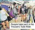  ??  ?? People take part in No Trousers Tube Ride