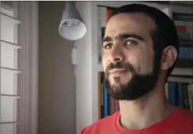  ?? COLIN PERKEL/The Canadian Press ?? Former Guantanamo Bay prisoner Omar Khadr, 30, is seen at a home in Mississaug­a, Ont., onThursday.Thefederal­government­haspaidKha­dr$10.5millionan­dapologize­dtohim for violating his rights during his long ordeal after capture by American forces in...