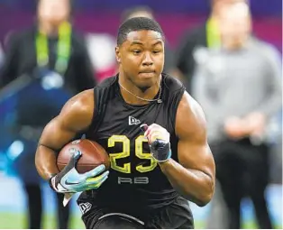  ?? DARRON CUMMINGS AP ?? Texas A&M running back Isaiah Spiller, running a drill at the combine, will join Joshua Kelley and Larry Rountree III in vying for time as the Chargers’ No. 2 running back behind Austin Ekeler.