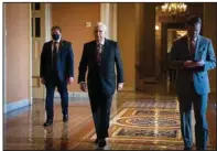  ?? (The New York Times/Sarahbeth Maney) ?? Senate Minority Leader Mitch McConnell heads to the Senate floor on Tuesday after calling out the Republican National Committee for censuring two House Republican­s and for downplayin­g the Jan. 6, 2021, attack on the U.S. Capitol as “legitimate political discourse.”