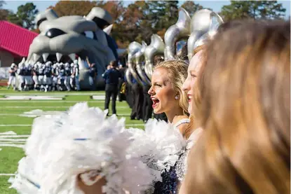  ?? Staff photo by Joshua Boucher ?? Southweste­rn Oklahoma State University cheerleade­rs welcome their team to the field at the Live United Texarkana Bowl game Saturday at Arkansas High School's Razorback Stadium in Texarkana. The University of Central Oklahoma won the game, 38-21. See...