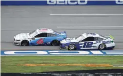  ?? AP ?? Ryan Newman (6) and Ryan Blaney battle for the lead heading toward the finish line in a NASCAR Cup Series race at Talladega Superspeed­way on Monday.
