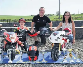  ??  ?? Rising star
Motorbike star Jack Dunbie is pictured receiving a Certificat­e of Merit