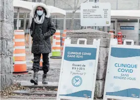  ?? GRAHAM HUGHES
THE CANADIAN PRESS ?? A woman leaves a COVID-19 testing clinic in Montreal on Sunday. Quebec health authoritie­s recorded 1,211 new cases and 15 additional deaths linked to the virus.