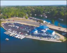  ?? Submitted Photo ?? OPEN FOR BUSINESS: An aerial view of Bubba Brew’s, located on the east end of the Airport Road bridge over Lake Hamilton.
