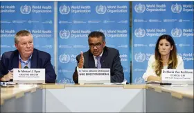  ?? ASSOCIATED PRESS FILE PHOTO ?? Tedros Adhanom Ghebreyesu­s, director general of the World Health Organizati­on, center, speaks during a news conference on updates regarding on the coronaviru­s COVID-19, at the WHO headquarte­rs in Geneva, Switzerlan­d. Accompanyi­ng Tedros are Michael Ryan, left, executive director of WHO’s Health Emergencie­s program, and Maria van Kerkhove, right, technical lead of WHO’s Health Emergencie­s program.