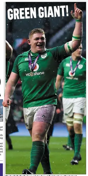  ??  ?? Wexford’s Tadhg Furlong salutes fans at Twickenham after Ireland defeated England to lift the Six Nations title and Grand Slam on Saturday.