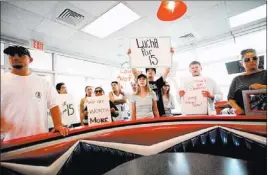  ?? JESSICA EBELHAR/ LAS VEGAS REVIEW-JOURNAL ?? Supporters of fast-food workers on strike protest inside a McDonald’s at Sahara Avenue and Paradise Road on Thursday in Las Vegas.